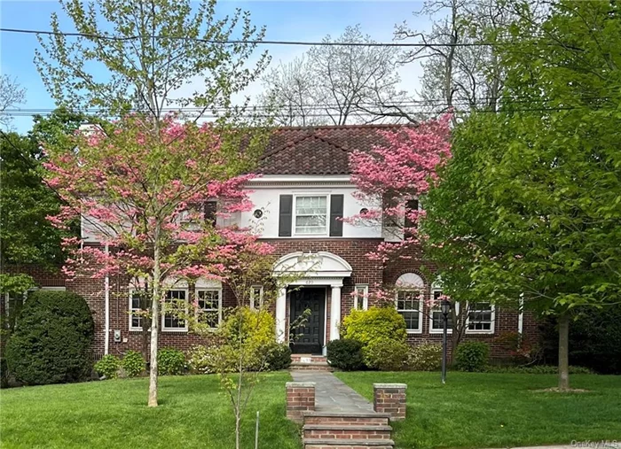 Set on nearly 1/2 acre on a premier tree-lined street, this majestic center hall colonial is the one you&rsquo;ve been waiting for. With an ideal walk-to-all location, this cheerful home boasts beauty and convenience. The grand entry foyer welcomes you to an inviting space made for parties and entertaining. On the first floor you&rsquo;ll find a bright living room with wood burning fireplace, formal dining room, two offices/sunrooms and a magnificent kitchen/great room. With marble counter tops, high-end appliances, an extra-large island and room to study or watch TV, the kitchen and adjoining outdoor patio are the perfect combination for making meals and enjoying time together. Upstairs, the primary bedroom offers a newly renovated bathroom with dual sinks and walk-in closet. Three additional bedrooms and an updated hall bath complete the second floor. The backyard offers plenty of green space for playing outdoors.