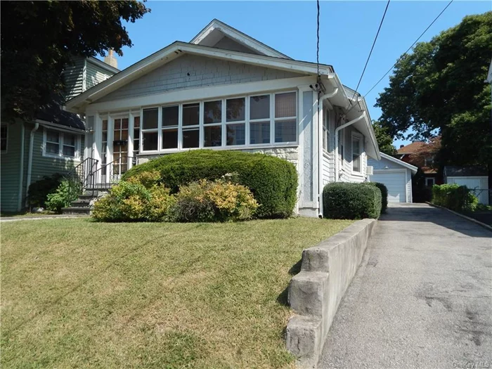 A 1930&rsquo;s bungalow waiting for new owners to bring it back to the glory years! This cozy home sits on a quiet tree lined dead end street close to all. It has 2 bedrooms, 1 bathroom with a large enclosed front porch. Hardwood floors, arched doorways and molding as seen. 1 car garage, with bonus room and long driveway. Close to shopping, parkways, and transportation. Brand new roof in 2021.