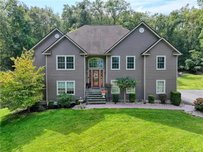 Generous in scale and full of thoughtful details, this home offers the complete package--relaxation, fun, and function. The property is meticulously landscaped, from the fabulous hydrangea that brightens the front yard to the ornamental grasses screening the back patio. Located at the end of Highland Road, and bordered by woodlands to the south and farmland to the west, this property is an oasis for summer fun on the deck, in the pool, or lounging on the sunny patio. The current owners had the home built to their specifications, and it shows in the large windows throughout, high ceilings, thoughtful floor plan, and quality materials chosen including hardwood floors in the living areas, carpeted bedrooms, detailed tile installations, and custom stonework. Two levels of living accommodate all your needs. On the main level, the large, open dining room can hold a crowd and is adjacent to a beautiful eat-in kitchen with loads of cabinets, double oven, granite countertops, and slider to the deck. In the living room, a beautiful fireplace flanked by tall windows is the perfect spot for gazing over the snowy landscape on winter days. There&rsquo;s a convenient powder room for guests, just off the living room. The primary bedroom features a tray ceiling, walk-in closet, and ensuite bathroom with soaking tub and walk-in shower. The two additional bedrooms have vaulted ceilings and windows overlooking the front yard, one with its own ensuite full bathroom. The lower level--with garage access and a walk-out french door to the back patio--is centered around a cozy den for movie watching and games. Off the den is a large office, a utility/laundry room, an unfinished space currently used as a gym, and a newly refinished full bathroom, just steps from the patio doors for easy access to the pool. This bucolic area of Ulster Park is convenient to Kingston&rsquo;s shopping, restaurants, and beautiful waterfront, while Rosendale, New Paltz, and High Falls are all under 20 minutes away. The Shaupeneak Ridge Park is a nearby 790 acre preserve with a lake, scenic views, and hiking trails to explore. Call to book a showing today!