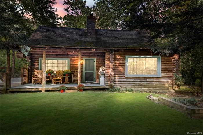 Set quietly back off the road, on 1.5 wooded acres, this charming log cabin awaits it&rsquo;s new owners to make their own! Featuring a spacious living room with soaring cathedral ceilings and a wood burning stove to warm those chilly nights. The centerpiece of the kitchen is the Heartland stove. This classic, high-performance stove features an electric oven with convection cooking and a warming drawer, making it perfect for everyday meals and special occasions. With its timeless design and exceptional functionality, not only enhances your cooking experience but also adds a touch of character to the heart of your home. Right off the kitchen is a small room perfect for home office or playroom. Bedroom with loft area and full bath also on lower level . A private laundry room with sink and cabinets for great storage and an extra freezer. Second level loft is where you&rsquo;ll find the primary bedroom en-suite. Outside there is a 2 car detached garage and a bar area. New Tankless heating system!