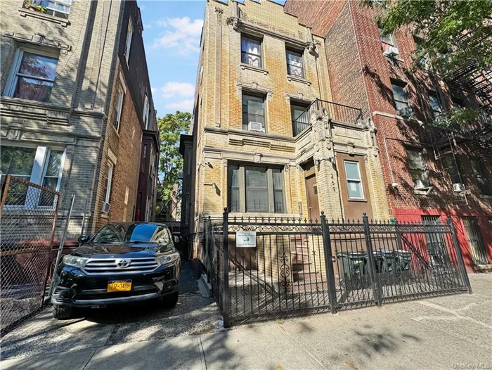 Welcome to this stunning legal 3-family home in the highly sought-after Mt. Hope section of the Bronx, zoned R7-1 for development and complete with garage parking. Perfect for both investors and owner-occupiers, this spacious property features three levels, each equipped with updated kitchens boasting stainless steel appliances, grey quartz countertops, and elegant flint grey cabinetry. The first floor offers 2 bedrooms, 1 bathroom, and a bright living area with beautiful hardwood flooring. The second floor includes 2 bedrooms and 1 bathroom, with a comfortable living space, while the third floor provides 3 bedrooms, 1 bathroom, and a generously sized living room. Additional highlights include a large backyard, a spacious finished basement with endless possibilities, and a one-car garage with space to park a second vehicle if needed. Situated in a vibrant neighborhood with parks, shopping, dining, and excellent transportation links nearby. Perfect opportunity for a savvy investor!