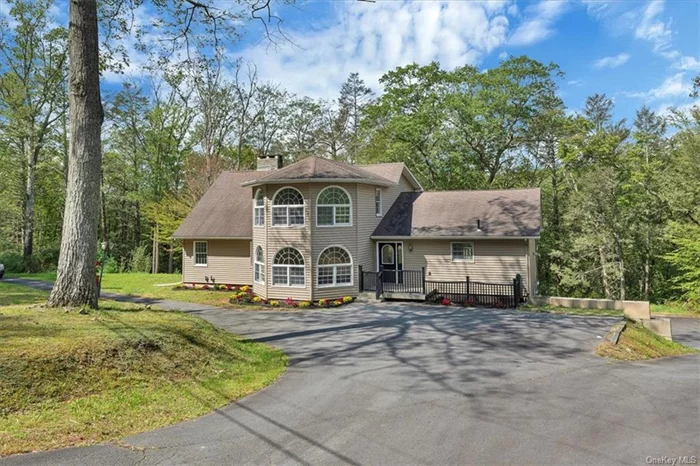 Discover this beautifully renovated colonial home featuring a spacious floor plan with 4 bedrooms and 3 full baths. Gleaming hardwood floors throughout the living room, dining room and kitchen. Cozy fireplace in the warm, inviting living room and sliders leading out to a lovely back deck from the dining room. Cathedral ceilings, expansive windows, granite countertops, tiled backsplash and center island with breakfast bar with seating overhang. The master suite includes a fireplace, walk-in closet, and a luxurious private bath with a freestanding tub and tiled walk-in shower. Three additional bedrooms and two more baths complete the home. Unlock the potential living space on the lower level, Central A/C, 3 car garage and full walkout unfinished basement included. Short drive to downtown with all shops, restaurants, brewery and public transportation (bus and train) making an easy commute. Embrace outdoor adventures with nearby Delaware River, perfect for fishing, rafting, and kayaking!