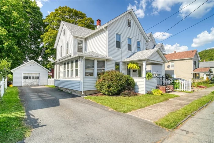 Welcome to 6 Grand St, located in the desirable West End of Port Jervis! This charming 2-story, 3-bedroom, 2-bathroom historic home offers 1, 676 sqft of living space, filled with original character and modern upgrades. As you approach, you&rsquo;re greeted by a covered front porch, perfect for enjoying the outdoors. The property features a 1-car detached garage, a paved driveway, and a fenced backyard complete with a patio for outdoor entertaining. Step inside to find beautiful hardwood floors throughout, original molding, and built-in shelves that add a touch of timeless elegance. The first floor boasts a full bathroom with laundry, along with a spacious, chef-inspired kitchen. This generous sized kitchen is equipped with stainless steel appliances, double sinks, a double oven with cooktop, granite countertops, an island, and tile backsplash. Recessed lighting and updated fixtures illuminate the space, while large windows let in plenty of natural light. Upstairs, you&rsquo;ll find three well-appointed bedrooms and another full bathroom. The home is situated within walking distance to downtown Port Jervis, offering easy access to shopping, entertainment, schools, and public transportation, including the bus and train to NYC. Major highways are just a 10-minute drive away, connecting you to Hudson Valley&rsquo;s wineries, hiking, and biking trails. This home combines historic charm with modern conveniences don&rsquo;t miss the opportunity to make it yours!