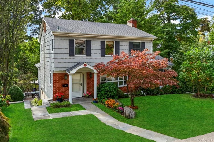 Discover this classic Colonial masterpiece, built in 1965 and offered for the first time by its original owners. Nestled in the sought-after Larchmont Woods neighborhood, this brick and shingle residence blends timeless charm with modern comfort, just moments from the vibrant heart of Larchmont Village. Spanning over 2, 000 square feet, this home boasts a thoughtful layout that invites natural light and a warm atmosphere. As you enter the foyer, adorned with elegant slate tiles, you&rsquo;ll appreciate the convenient hallway closet. The formal living room features a cozy wood-burning fireplace, exquisite crown molding, and a lovely bay window that frames picturesque views of the surrounding area. Adjacent to the living room is a well-appointed office. The formal dining room, enhanced by crown molding and a classic chair rail, leads to an oversized eat-in kitchen. This inviting space includes an island with a wet bar, floor-to-ceiling windows, and cathedral ceilings that provide lovely views of the expansive .18-acre level yard. This versatile area can be used for dining or as a family room, making it ideal for gatherings. Conveniently located off the kitchen, a laundry room provides ample cabinet storage, complemented by a powder room featuring a pedestal sink. On the second floor, the primary bedroom includes two spacious closets and a private full bathroom with a stand-up shower. Three additional bedrooms, each with generous closet space, share a full hallway bathroom with a bathtub and a linen closet. A pull-down attic offers additional storage options. The finished lower level adds an impressive 619 square feet (not included in the total square footage), making it perfect for a family room, playroom, or home gym. With three closets and built-in shelving, this space is both functional and versatile. Sliding doors lead to an oversized bluestone patio, ideal for entertaining or summer BBQs, all overlooking the expansive yard that invites outdoor fun. Additional features include an attached one-car garage with storage and utility space, along with a long driveway for ample parking. This move-in-ready home offers an unbeatable lifestyle, just a short walk from downtown Larchmont, the Metro-North train station, and a variety of shops and dining options. Enjoy the best of both worlds tranquility at home and easy access to urban amenities. Don&rsquo;t miss your chance to own this incredible property it&rsquo;s a rare opportunity that won&rsquo;t last long!