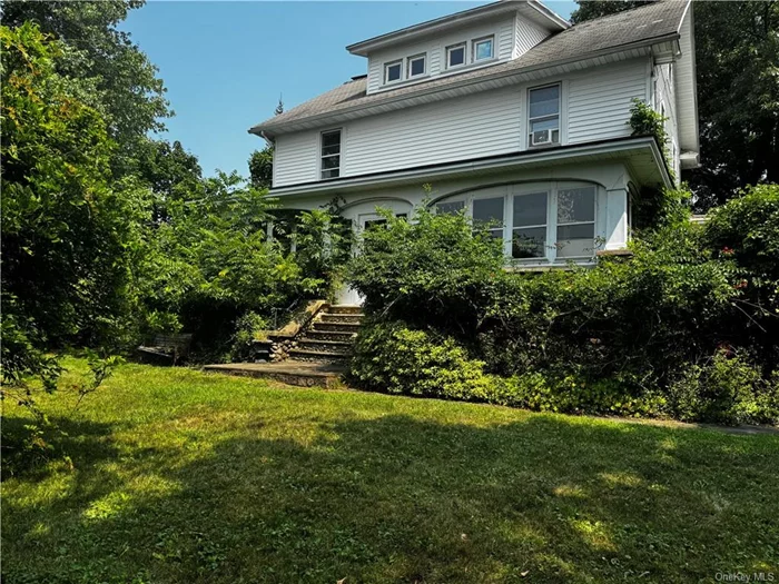 If you are looking for your dream home in just slightly the outskirts of downtown Nyack, NY, yet close enough to access the best of it all, then here it is! Spacious and charming 1924 Colonial with river and bridge views from upper levels perfectly appointed at the top of the hill , across from the school and seconds to Nyack Hospital on the corner of 5th Avenue and Central! Enclosed front porch, hardwood floors, spacious rooms, a finished 700 sf attic with a full bathroom, unfinished basement with stairs from the kitchen or outside bilco doors, small patio area. Total of 4 BRS 2.5 Baths, a living room with fireplace, formal dining room, an updated Eat in Kitchen, large full bathroom on second floor , extra lot available adjacent and behind home for additional $535, 000.