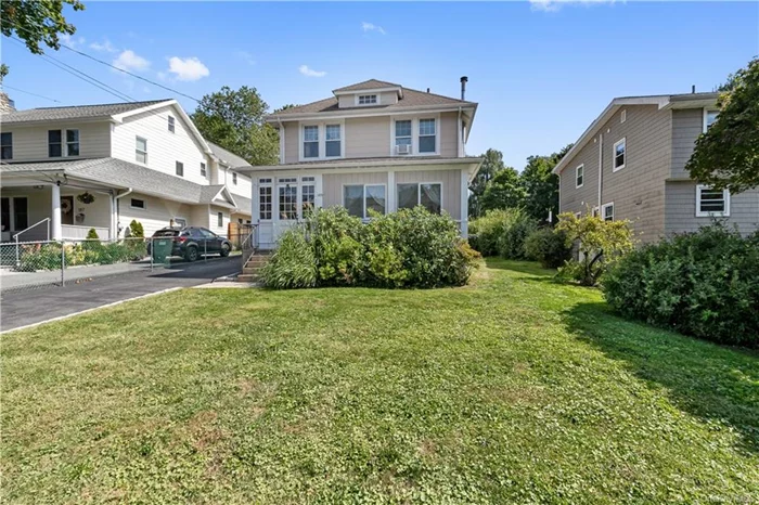 Welcome to this Charming and Updated Village Colonial less than 1/2 mile to Train Station! This tastefully cared for home features a beautifully renovated Kitchen with New Cabinets, tons of Counter Space, Gas Stove and beautiful lighting, open to the Dining Room with Hardwood Floors, Living Room and den/family room...upstairs you will find 3 Bedrooms and Beautifully Updated Hall Bathroom. The Basement level has tons of potential with Large Storage Room, Cedar Closet, Full Bath, Laundry and Utilities w/ Bilco Doors to Rear Yard. The Detached OVERSIZED 2 Car Garage has staircase to a full Attic with TONS of storage and possibilities! Enjoy the large Level Rear Yard with patio and beautiful stone walls. This home has been lovingly cared for with so many improvements in the last 10 years including, updated Gas Heating system, Roof, Driveway, rock walls, and Windows. Amazing location just 0.4 miles to train and town. Close to Schools, Restaurants, Shopping and Saw Mill Parkway!