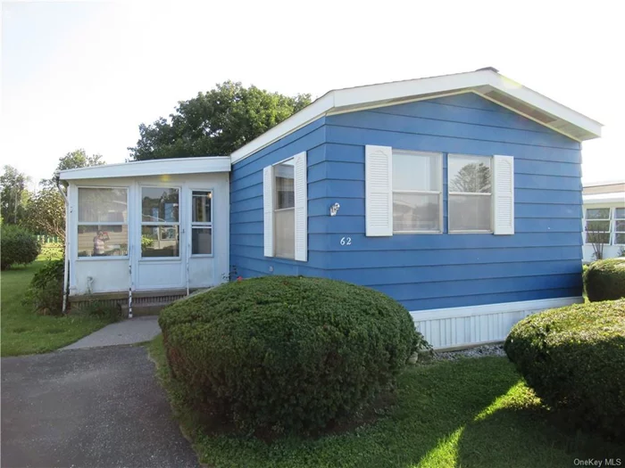 One of the most economical homes in the area! Light and bright with windows in every room, this 2 bedroom, 2 bathroom mobile home is in Powell Park - an age 55+ community in Dover Plains. Located on a cul-de-sac with a large open green space directly behind  this home is private without losing its neighborhood feel. Open concept Living Room with Dining area has a built-in china cabinet for extra storage and service shelf for dinners with friends and family. The Galley Kitchen has loads of counter space and cabinets, double sink and a very accessible pantry for stocking up. Washer/Dryer conveniently located between the Kitchen and Main Bedroom - which has enough room for a king size bed and mirrored walk in closet with built in shoe rack.  En-suite Bathroom with an ample sized linen closet, tub/shower and medicine cabinet. Second bedroom has access door to main bathroom and built in desk for so many uses. Other features include: Berber carpet, Ceiling fans, 3 year old stove, newer washer/dryer, exterior painted 2 years ago, storage shed, clothes line and 3 season room for outdoor living. Off street parking for 2 cars. You can move right in and put your personal touches on this home to make it your own.