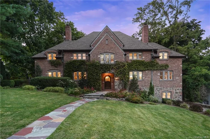 Your dream home in Larchmont&rsquo;s coveted Rouken Glen neighborhood is finally available! Nestled in a private and tranquil setting backing up to the Leatherstocking Trail, 27 Glen Eagles Drive is a magnificent French Tudor home by renowned builder C.W. Moody that has been thoughtfully and tastefully updated for modern living while retaining the character and architectural details of Moody&rsquo;s original design. When you enter the home through the arched wooden door, you are greeted by the gracious entry foyer with a vaulted ceiling. The enormous, open floor plan gourmet kitchen with breakfast area and family room provides spaces for everyone and makes entertaining a breeze. In addition to the main kitchen - a chef&rsquo;s dream, featuring high-end stainless steel appliances, quartz counters, and a large island - there is a separate baking kitchen with its own island and appliances so that multiple chefs have plenty of space to work together simultaneously. The formal dining room features French doors that lead to the patio and backyard. The living room is grand and spacious, and features a second set of French doors that leads to a serene covered porch that is perfect for gatherings with friends and family. Completing the main floor is a sun-drenched office with wraparound built-in shelves. Upstairs, there are four generously-sized bedrooms. Wake up each morning in the primary bedroom suite revitalized and inspired by views of the rear of the property and the Leatherstocking Trail. The primary bedroom suite features a fully decked out 15.5&rsquo;x7&rsquo; walk-in closet, and a spa-like bath with a double-vanity, soaking-tub, and separate shower. The middle two bedrooms share an updated Jack-and-Jill bath, and the fourth bedroom has an exquisitely renovated ensuite bath and a walk-in closet. On the third floor, you will find a massive finished open space with vaulted ceilings and another updated full bath with tub and shower combination. This area can serve many purposes - playroom, family room, bedroom, office, home gym - the possibilities are endless. Finally, the lower level offers a laundry area, ample storage, access to the garage, and the piece de resistance - separate guest quarters with a full bath and private, no-step entrance, perfect for guests. This stunning home is situated on over a third of an acre of property, and is located just a mile and a half from the Village of Larchmont and the Larchmont Metro North station, which will take you to GCT in as little as 35 minutes. Don&rsquo;t miss this incredible offering!