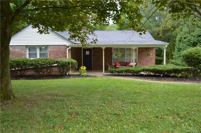 Step into this charming 1, 200 sq ft ranch-style home wrapped in a timeless brick. With 3 bedrooms, 1 bath, kitchen, dining and living room all on one level. This home features hardwood floors, central heating and AC and municipal water and sewer. It is freshly painted and move-in ready. Located a short 12-minute drive to the Beacon Metro North train station and offers easy access to many shopping and dining destinations, including a 10-minute drive to the Newburgh waterfront.  Embrace the opportunity to make this cheerful sanctuary your own a place where timeless charm meets outgoing vibes, creating a life filled with laughter, love, and unforgettable memories.