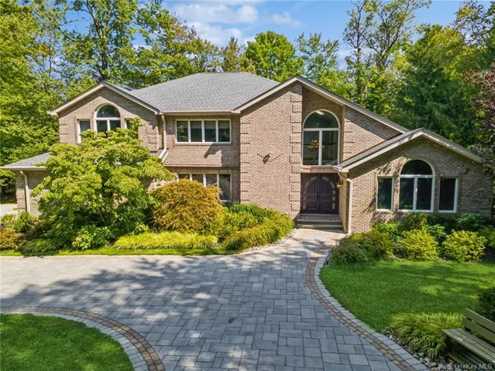 Quiet Luxury in this superb Palisades NY home sitting on 1-Acre. This 5-bedroom, 4.5 bath home is perfectly positioned in the prestigious and serene community of Palisades NY. Known for its natural beauty, safety and privacy, this community offers a peaceful, small-town feel with the added benefit of being just 20 miles from Manhattan making it an ideal location for buyers who desire the tranquility of suburban living without sacrificing proximity to NYC. Outdoor enthusiasts will relish the nearby Tallman Mountain State Park, offering hiking trails with breathtaking views, picnic areas, and opportunities for outdoor recreation. Home also sits in the South Orangetown Central School District, known for its high academic excellence and strong community involvement. A nice choice to enjoy this home and the surrounding area in one of New York&rsquo;s most desirable communities. Passing through the electronic entry gates and into the expansive, private grounds, you&rsquo;ll discover your very own resort-style retreat. The centerpiece of the outdoor space is the custom, therapeutic saltwater pool, illuminated by thoughtfully placed lighting, creating a serene ambiance. A small, cascading waterfall flows into the pool, providing the soothing sounds of nature, while the built-in spa tub offers a perfect place to unwind after a long day. Just steps away, the covered veranda invites you to relax or entertain in style. Outfitted with an outdoor grill kitchen, this area is ideal for hosting summer gatherings or evening dinners al fresco. The stone flooring gives the entire outdoor space an elegant feel, while a large swath of grass adds a lush contrast and provides ample room for outdoor fun & games. Completely fenced and encircled by mature landscaping and shrubs, the property offers an unparalleled level of privacy and seclusion on its expansive 1-acre lot. Step inside from the grand entry and it feels like home. The kitchen offers an exceptional blend of functionality and luxury. The open-concept design, with Wolf oven and Sub-Zero Refrigerator ensures ample room for cooking and entertaining, with multiple workstations and island, all topped with thick granite slabs. The full-size wine fridge and wet bar is the perfect complement for buyers who enjoy curating and displaying their wine collections, making this kitchen not only functional but also an entertainer&rsquo;s paradise. Whether preparing a casual meal or hosting a grand event, this kitchen is fully equipped to meet the needs of the most discerning home chef. The impressively large primary suite blends comfort and sophistication. The bathroom has opulent Carrera marble tiles that gleam under the natural light pouring in from the skylight above. Relax in the jacuzzi tub or refresh in the spa shower, equipped with jets and rainfall showerheads for a truly immersive experience. The radiant-heated floors ensure that every step is warm and inviting, offering a daily indulgence in luxury. With 4 additional spacious bedrooms and 3.5 beautifully designed bathrooms, this home will provide ample space for family and guests. With both sophistication and comfort, this property is ready to become a great home to enjoy for many seasons.