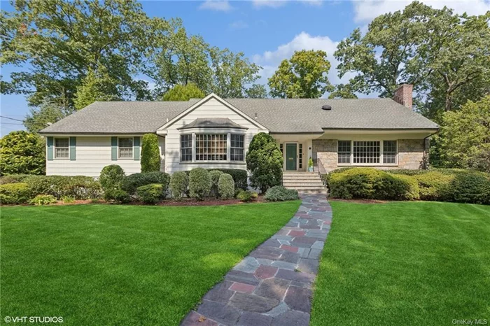 Welcome to the meticulously maintained mid-century home, blending classic charm with modern enhancements, located in the heart of the coveted Aspen Park neighborhood within the Scarsdale School District. This move-in-ready 5-bedroom, 4-bath residence sits on a lush, level property and boasts a range of exceptional attributes. Upon entering, you&rsquo;re greeted by a double-height foyer that leads to a bright living room, where an oversized window floods the space with natural light. Anchored by the wood-burning fireplace this room presents the perfect spot for cozy gatherings or any kind of celebrations. The living room opens up into the formal dining room and an impressive chef&rsquo;s kitchen, complete with high-end cabinetry, granite countertops, a large island, and top-tier stainless steel appliances, including a Sub-Zero fridge, Viking cooktop, and Thermador double wall ovens. Adjacent to the kitchen is a breakfast area, offering deck access for easy indoor/outdoor living. Across the kitchen, a cozy den/TV room with a bay window provides the perfect spot to wind down. The bedroom wing boasts a luxurious primary suite, featuring a spacious bedroom with dual exposures, an en-suite bath with large shower and double vanity, and generous closet space. Two additional bedrooms, a hall bathroom, and a laundry area complete the main floor. Upstairs, you&rsquo;ll find two private bedrooms (one currently used as an office), a hall bathroom, and a second family room, now serving as a striking entertainment space. The lower level offers convenient access to an oversized two-car garage, a mudroom, and exercise room along with a large storage/utility space. The above-grade recreational room presents tremendous potential for leisure and entertainment, with direct access to a charming stone patio and space that comfortably accommodates a full-sized billiard table, along with areas for seating and hobbies. The serene backyard, surrounded by mature plantings, is ideal for outdoor enjoyment with a spacious two-tier deck, stone patio, a BBQ area with a gas line, and ample space for play, entertaining, and relaxation. This exceptional home combines the timeless appeal of a mid-century expended ranch with modern updates, making it the perfect choice for those seeking comfort and style in the highly desirable Village of Scarsdale.