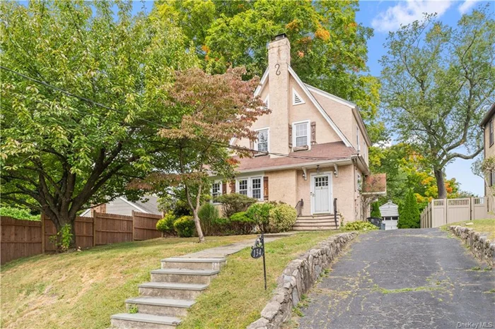 Welcome to 134 Grant Ave, a Tudor-style home on a .14-acre lot in White Plains, NY. This charming residence features 3 bedrooms, 2 bathrooms, and elegant details like crown moldings and hardwood floors. Enjoy living area, kitchen, and a deck overlooking a nice yard. Upstairs, you will find the primary bedroom, two additional bedrooms and a full bathroom. The full basement offers laundry, a full bathroom, open space and utilities. This property is just minutes away from shopping, dining, parks, and transportation.