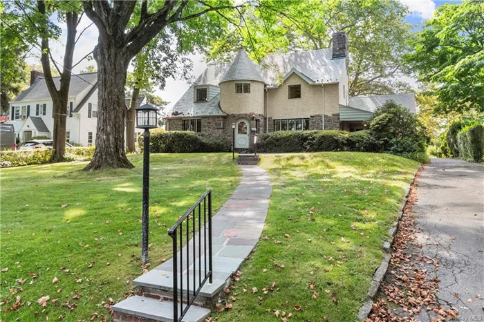 Enter the exclusive oasis of Gedney Farms, one of WP&rsquo;s most sought-after neighborhoods - only 35 mins to NYC! Classic 3 bed/3 bath French Normandy Tudor features handsome hardwood floors & spacious well-proportioned rooms. A welcoming entryway flows into an oversized living room w/ extra ceiling height showcasing bow window & a wood-burning stone hearth fireplace. Natural light fills space through leaded-glass windows; dining room opens to eat-in kitchen that has a side door to spacious backyard & perennial gardens. Cozy study adjacent to full bath with serene backyard garden views; inviting covered exterior porch patio off living room offers covered access to/from garage. 2nd floor features Primary bedroom ensuite w/ a big walk-in closet, 2nd closet & sizable office/lounge sitting area. Two additional bedrooms & full bath complete 2nd floor. Lush landscaping, magnificent foliage, and alluring architecture are among the hallmarks of this attractive enclave with country-like serenity.