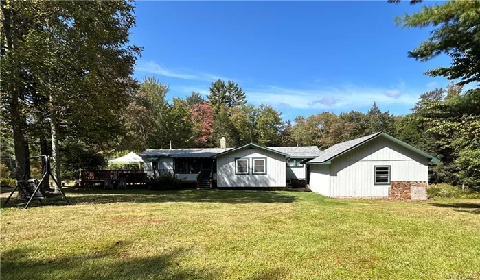 Great Starter Home or an inexpensive weekend get away place. Well maintained 3-bedroom, 1- bath home situated on nearly 4 acres of private land in scenic Neversink, NY. This peaceful retreat features a spacious screen-in porch, perfect for enjoying summer evenings, and a large deck, ideal for entertaining or relaxing in the serenity of nature. Plenty of room for gardening, outdoor activities or simply relaxing. Tri Valley School District, close to the Neversink Reservoir, Liberty for shopping and restaurants. Just two hours from the GWB and a few miles from Rt17.