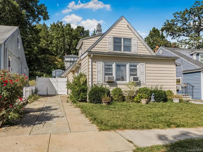 This charming, well-kept home has a two-bedroom, one-bath house conveniently located on a dead-end, tree-lined street. The large living room is inviting and bright, with hardwood flooring throughout. The modern kitchen has ample cabinets and granite countertops leading to the dining room (currently used as a bedroom). There is a first-floor bedroom with a hall bathroom. Bedroom #2 on the second floor has an adjoining room currently used as an office. Fenced-in backyard with large patio and vegetable garden. The lower level has ample storage space and laundry. Ideal for the commuter, blocks to major highways ( I-87 and Saw Mill River Parkway), Shops, Buses, and Trains.