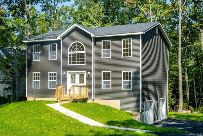 Sandy beaches, pristine lakes, sparkling pools, and crisp mountain air. Welcome to Emerald Green and the Sullivan County Catskills. 379 Old Sackett Road is a newly built, center hall colonial with partial lake views, located on a tree-lined street. The house features 2, 313sf with 4 bedrooms & 2.5 bathrooms, plus an un-finished basement and a two-car garage. A smart floorplan with spacious rooms, central heating/air conditioning, quartz countertops, hardwood floors, and ample closet space all add to the functionality of this house, which will soon be called home. Situated on a generous 0.40-acre lot, there is room for everyone to enjoy the peaceful setting. The main level features a captivating foyer with soaring double height ceilings and oversized windows. The chef&rsquo;s kitchen offers quartz countertops, an island with a breakfast nook, and plenty of space for a table. A sliding door leads out to the deck and backyard allowing for the perfect flow of indoor-outdoor entertainment. The massive dining room can easily accommodate a table for the whole family. There is a large living room, as well as a bonus room which can be used as a family room, guest room, or home office. There is also a half bathroom on this floor. The upper level has four bedrooms, a hallway bathroom with a tub, and a laundry closet. The primary bedroom is very spacious, and it features vaulted ceilings, a walk-in closet, and a full bathroom.  The un-finished, walkout basement offers additional space for recreation, a playroom, or storage. The two-car garage can easily accommodate two large vehicles, as well as shelves for all your storage needs.  Emerald Green is Sullivan County&rsquo;s premier private community. It offers two new pools that are located at the lakeside sand beach. There are three lakes for boating (non-gas boats only) fishing, and swimming. Boat slips are available for rent. There are also communal playgrounds, basketball courts, tennis courts, pickleball courts, a dog run, and an indoor clubhouse with a gym and walking track. Emerald Green offers community events such as holiday celebrations, seasonal fireworks, children&rsquo;s activities, exercise classes, game nights, etc. It is the perfect way to experience quiet country living in a friendly and serene neighborhood setting. This property offers the benefits of municipal water and sewer, as well as road maintenance and snowplowing provided by the town.  Rock Hill is the perfect place for a country getaway or full-time home. With its small-town charm, convenient shopping options, and proximity to the city, this is the place to be in Sullivan County! * Please note that this house is currently under construction. The photos and floorplans are from recently completed houses by the same builder and will look very similar to the finished house but may not match exactly. Occupancy expected August 2024. ** The listed annual real estate taxes are estimated based on similar houses that were recently built in the neighborhood.