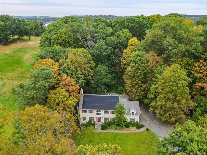 Welcome to 55 Bloomer Road, an expansive colonial in North Salem, close to all! You are greeted by a grand double-height entry foyer that sets the tone for the main floor, which includes a spacious eat-in kitchen, dining room, powder room, and open living area. The living area leads to a deck with a pergola and a heated in-ground pool, perfect for outdoor gatherings. Upstairs, find the primary bedroom with two walk-in closets and a spacious ensuite bath. Two additional bedrooms, a hall full bath, and a laundry room complete the second level. The finished lower level offers an additional 1, 040 SF of versatile bonus space for an office, gym, or playroom. This home also features a legal accessory unit with a separate entrance, ideal for an in-law suite, au pair, or rental income. The two-car attached garage and ample driveway parking provide convenience, while solar panels keep operating costs low. Situated on 0.75 acres, this home is conveniently located near highways, restaurants, golf clubs, farms, parks, and trails.