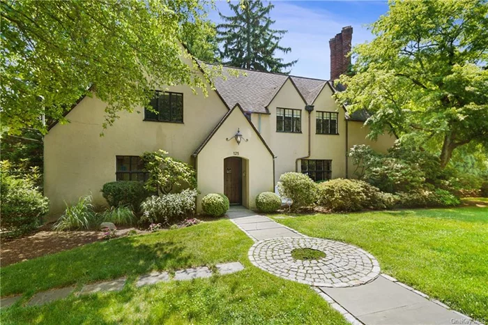 This grand work of celebrated architect Lewis Bowman located in a poet&rsquo;s corner at the periphery of Bronxville&rsquo;s Lawrence Park is an excellent example of residential elegance found in the area. It is found in a unique horseshoe shaped grouping of homes in Tuckahoe that is only accessible by Bronxville streets. Period character blended with modern lifestyle comforts and conveniences are consistent with what one finds in the adjoining Bronxville Hilltop neighborhood. The craftsmanship and detail are exceptional. Bespoke millwork, casement windows, handsome hardwood flooring and substantial interior doors with mostly original hardware are standard. Striking French doors open from the foyer into a gracious living room with a cast stone wood burning fireplace. Casement steel doors lead outside to a wraparound stone terrace and al fresco covered porch. The spacious dining room accommodates a large dinner party. Updated chef&rsquo;s kitchen with generous cabinet storage and counter space includes a center island and eat-in area. Also found on the main level are a private study and powder room. An intricately patterned iron balustrade capped by a brass handrail guides you upstairs to the bedroom level. A large primary en suite bedroom is flanked by an en suite guest bedroom and a second guest bedroom with a dedicated hall bath. There is a conditioned bonus room on the third level and finished space in the basement. Two bay attached garage.  This home awaits your stewardship into its next century of refined living.