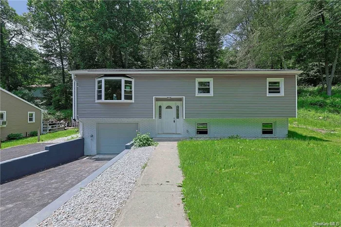 Discover this charming 2, 500+ sq ft Raised Ranch at the end of a quiet cul-de-sac in Patterson, NY. Set on a .29-acre tree-lined lot, this newly updated 4-bed, 2-bath home offers the perfect blend of space and comfort. First floor features 3 bedrooms, full bath, living room, dining area, and large kitchen. The versatile basement includes a spacious hang-out area with fireplace, bedroom/office, half bath, utility and laundry rooms. Enjoy outdoor living on the partially enclosed back deck.  1-car garage provides convenient parking and storage to go along with a freshly paved driveway with two spacious parking spaces. This turnkey property combines modern updates with a peaceful setting, ideal for families or those who love to entertain. Experience the best of Patterson&rsquo;s scenic beauty and community feel. Don&rsquo;t miss this opportunity  schedule your viewing today and make this house your home!