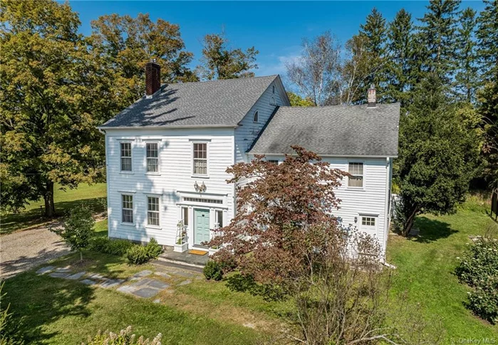 This historic 1800&rsquo;s home of James Mabbett was built on the eastern edge of Millbrook in the hamlet of Mabbettsville named for the family. In 2024 the fine architectural details were restored and the home renovated and updated with new baths and kitchen, appliances, fixtures, mechanicals, gleaming hard wood floors, moldings and coffered ceilings. Enter the high ceiling elegant foyer which leads to the formal living room opening to the formal dining room enhanced by corner cabinets. Large windows throughout bring in ample sunshine and views. Through the heated back foyer and mudroom to the early section of the home, the kitchen joins the family room. Back stairs lead to two bedrooms, hall bath, the large project/laundry room and access to the attic. Ascending the elegant carved front staircase, you reach the primary bedroom with en-suite bath, two bedrooms and hall bath. The hallway then connects to the early section of the house, which was originally a tavern. The 1920 large barn consists of three finished rooms currently used as a private art gallery, a loft, workshop and covered porch looking out to 4 lovely acres and a sparkling spring fed pond. A two-car garage is attached. Hamlet zoning presents many possible commercial options. Convenient to the Town Park, village shops, schools, and other amenities as well as 10 minutes to Metro-North, this is an old treasure for a new century. 24 hour notice required for accompanied ahowings/