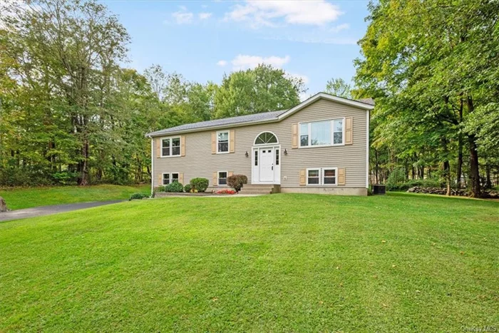 Charm & Sunshine await you in this bi-level home. Pride of ownership is obvious and has been meticulously maintained. The living room provides a cozy and inviting space for entertaining guests. For those who enjoy dining in style, the formal dining room opens up to a spacious composite deck, offering a wonderful setting for outdoor enjoyment during warm weather. The deck overlooks beautifully maintained park like property. The kitchen makes every square inch count with an efficient design and Granite counter tops, stainless steel appliances, hardwood floors tiled backsplash and oak cabinets. Comfort and tranquil characterize the primary bedroom offering a private primary bathroom. The two additional bedrooms on this floor are light, bright and roomy and share a hall bathroom with granite counter top and surround tub. The built to take it lower level family room with vinyl planking floors is ideal for today&rsquo;s casual living. A half bath and laundry room completes the lower level. Other updates include; new exterior doors, sliders, hot water heater, well pump, roof and windows all replaced in 2020.