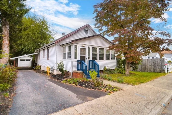 Welcome to 57 Dinan Street! Pride of ownership shines from within this beautiful two-bedroom, one full bath home with fenced-in backyard. Home offers an open feel, with great light shining within and is finished to perfection. Updates include a brand-new roof, new windows, kitchen, bathroom and freshly painted throughout. The enclosed front porch is the perfect place to sit for morning coffee or watch the sun come up. The extra-large covered rear deck is the perfect spot to watch the sun go down. There is a detached one-car garage with a brand-new overhead door and carport. Located just four blocks from Main Street as well as the Metro-North train station. A perfect combination for a new owner!