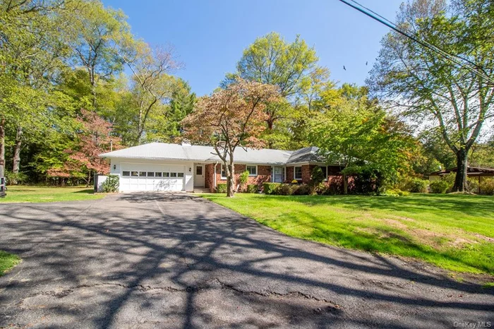 Rare Village gem. This beautifully preserved mid-century 4 bedroom, 2 bath brick ranch rests on 1.19 acres, combining architectural significance, space and privacy. A testament to quality craftsmanship, this one-owner home is rich with authentic mid-century design, offering distinctive details that set it apart. The formal entryway opens onto a stunning living room, highlighted by a striking brick fireplace and floor-to-ceiling windows that flood the space with natural light perfect for entertaining or quiet, relaxing moments at home. The formal dining room, eat-in kitchen and pristine vintage tile baths echo the home&rsquo;s era while remaining in exceptional condition. The full finished basement expands the living area, featuring a built-in bar, entertainment room, abundant storage and a separate Bilco entrance. Outdoors you will find manicured lawns and expansive front, rear and side yards, plus a tranquil wooded area that offers privacy and exploration. Thoughtfully landscaped with stone walkways, steps and accents, the property is perfect for relaxing or enjoying the changing seasons, especially the vibrant fall foliage. Lovingly maintained by its original owner, this home stands as a testament to mid-century style and quality craftsmanship and is now awaiting its&rsquo; next chapter! u