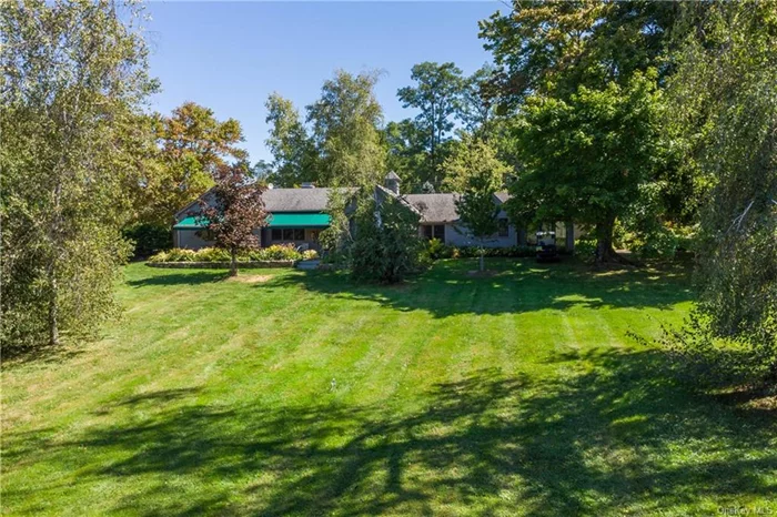 First time on market in 44 years, this 4.08 acre magical property on Quaker Hill has been fully renovated. One won&rsquo;t believe the charm, character, interest & detail that has been added. Wall to wall bookshelves in the primary suite, w/a large wic, a bathroom w/shower & pocket doors, floor to ceiling windows to absorb the outdoors & guest cottage w/deck & patio nestled in a Birch grove. The LR has built in bookshelves, a fplc w/new liner & custom mosaic hearth, antique beams, chestnut floors, a French dr. to the patio w/awnings facing west for sunsets; the spacious DR opens to the eat in kitchen, office & 2nd full bath w/soaker tub & mosaic tile. The kitchen has deep custom built cabinets w/1930&rsquo;s handles, & a washer/dryer. The office w/2 desks & built in cabinets has lovely views of the gardens. The Florida room has bluestone flrs, high ceilings, electric skylights & a wall of French drs. to the hidden garden. The heated spa, arbors, fern gardens & workshop complete this mini estate!