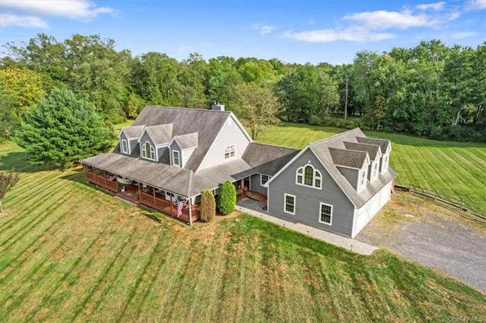 STUNNING New Paltz area cape on more than 6 acres, with a legal 1-bedroom accessory apartment, and jaw-dropping front yard views of the world-famous Shawangunk Mountains! Oh, and how about a 3-story * * * ELEVATOR! * * * More than 4, 500 square feet, also includes 3-car garage, 5 bedrooms (4 in main house), 4 full baths (3 in main house), expansive (70x18) back deck (Trex) with hot tub, main floor primary en suite, partially finished basement. The ultimate in curb appeal with classic country wraparound front porch. The vaulted-ceiling living room area also boasts fireplace fitted with pellet stove, which opens into kitchen with large island and 5-burner cook top. Laundry/mud room off kitchen, as well as a formal dining room. Primary bath includes shower, jetted tub, walk in closet & direct access to back deck. Terrific craftsmanship with wide-plank oak floors, 6-panel hardwood doors (many pocket doors, too). RADIANT HEAT on main level, garage & apartment. Huge backyard borders Shawangunk Kill waterway -- perfect for kayaking. Generator and invisible dog fence, too. Private, yet close to so much!