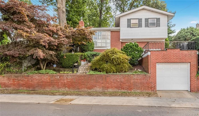 Immaculate and pristine 2 Bedroom /2 Bathroom split Level Home located in the heart of East Yonkers featuring a 1 Car Garage. This sun-drenched Home boasts a spacious Living room, dining area and an updated Kitchen with Granite tops. This wonderful Home is nestled back off the street with a wonderful size primary bedroom plus a generous 2nd bedroom and a newly renovated Hall bathroom. There is additional living space in the lower level that lives like a 3 Bedroom which is complete with a family room, recreation, full bath and plenty of storage. Enjoy easy living on the Front deck which is great for some rest and relaxation. The back yard features a Patio and has plenty of space for entertaining. Truly a commuters dream- just blocks away from the Metro North Train, Buses, shopping centers, major parkways and 25 minutes to Manhattan. This charming and quaint home is the perfect blend of comfort, convenience and affordability.