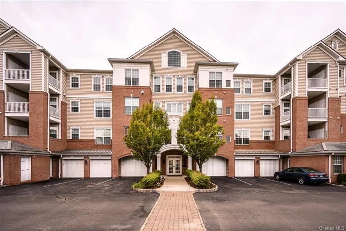 Experience luxury living in this corner unit at the premier 55+ community in Fishkill, NY. Former model home, built with top-of-the-line upgrades, features open-concept layout with 9 ft ceilings, tray ceilings in entry foyer, wide plank hardwood floors, plantation shutters throughout the kitchen and primary suite. Chef&rsquo;s kitchen boasts granite countertops, stainless steel appliances, movable marble island, and formal dining area. The primary suite with en suite bathroom has a dual-sink granite vanity, Roman soaking tub, glass shower, custom high end wall moldings and walk-in closet with custom built-ins. Second bedroom has textured wallpaper and wainscotting, an upgraded hallway bathroom with Shower/tub and granite vanity. Custom floor-to-ceiling Built-Ins located in the living room and Office. In-unit laundry, Private patio, and private garage spot in front of the building. Access to a private clubhouse, fitness center and pool.