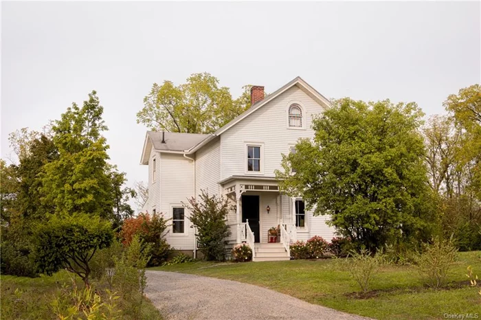 Bonny&rsquo;s Farmhouse is a charming and remarkably well-preserved 19th-century home situated on two idyllic acres off a dead-end road on the outskirts of Germantown&rsquo;s historic center. The Home Built in 1894 for Philip W. Rockefeller III, the property has only seen a few families at its helm over nearly a century and a half. Decades of thoughtful ownership are evident in the abundance of unspoiled historical details that adorn this light-filled home, the highlight of which is, without a doubt, the beautifully maintained original millwork throughout.  The ground floor at Bonny&rsquo;s Farmhouse is vibrant, each room with its own purpose. The expansive front living room with wood-paneled ceilings floods with sunlight throughout the day, perfect for lazy mornings and afternoons, while a dark-hued parlor towards the back begs for evening cocktails and snug nights in. The kitchen is bright and expertly renovated, with views of the oldest trees on the property and its own exit to the home&rsquo;s gardens. An inherently social space, the kitchen has wide doorways opening to both the dining room and the parlor. A screened-in porch surrounded by hydrangeas completes the first floor. Upstairs, the bedrooms are grand in scale and lined with windows facing surrounding lush treetops. There are several large built-in closets, a rarity in a home of this vintage, as well as ornate radiators, beautiful original wood floors, and tall ceilings. A golden-hued office can also be used as a nursery or walk-in closet. Stairs lead up from the second floor to the spacious attic with a stained glass window, currently utilized as storage but could be restored into a dream studio or an additional bedroom.  The Grounds Walking trails meander through the property&rsquo;s 2 acres, lined by ancient Catalpa and Oak trees and berry bushes. One of the paths leads to a large clearing with a fire pit, a historic equipment barn, and ample room for a vegetable and flower garden. A two-car garage with carriage doors and multiple windows would make for a perfect workshop or artist&rsquo;s studio.  The Region Bonny&rsquo;s Farmhouse is just moments away from Germantown mainstays like Otto&rsquo;s Market and Gaskins, and a short drive from our favorite farmstands (Montgomery Place Orchards and Morningstar Farms), beautiful Hudson River estates and gardens open to the public (Clermont State Historic Site, Olana, and Montgomery Place Gardens), and the Hudson Valley&rsquo;s most beloved towns (Hudson, Tivoli, and Red Hook).  The History This exquisite farmstead is deeply embedded in the fabric of Germantown&rsquo;s 20th-century history. Philip W. Rockefeller III and his wife Margaret E. Miller built the house in the late 1800s, where they would then have and raise their only child, Lila Bonny. Lila lived almost the entirety of her life at this house, from her birth in 1896 to her passing in 1991.  After a brief stint away from Germantown, Lila returned, newly wedded to her husband Harold Denegar, upon the death of her father Phillip in 1921. Harold would later become the Postmaster at the local Germantown post office, and the couple would live, work, and raise their families through a world war and the Great Depression alongside the Lashers, the Lawrences, the Millers, and Coons - other founding families of the town.  Lila and Harold had two children, Harold Russell &rsquo;Russ&rsquo; and Vernon. Harold, who went by Russ because his mother Lila didn&rsquo;t love the idea of two Harolds in the same family, was very involved in documenting his family&rsquo;s time spent in their quaint farmhouse. In an interview, Russ described the tomato farm lined with raspberry bushes overlooking the Hudson River that his parents owned and how he would often come home to his mother canning tomatoes and cooking down berries for jam. While undoubtedly a home well-suited to modern life, the traces of this rich history can be felt at every corner of this exceptional property.