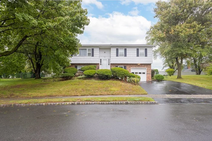 Welcome to this coveted Knuteson-built bi-level home on a premium lot in Nanuet (Clarkstown South Schools). Just minutes from Lake Nanuet Park, enjoy nearby swimming, playgrounds, and ballfields. The main level features new flooring, a beautiful updated eat-in kitchen with stainless steel appliances (2024), spacious living & dining rooms, primary bedroom w/updated lavatory, 2 additional bedrooms & updated hall bath. Step through new sliders to the rear deck, perfect for enjoying the morning sunrise. The lower level features new flooring, a large family room, fourth bedroom, full bathroom, laundry/utility room, and access to the garage. Throughout the home, you&rsquo;ll find all-new recessed lighting, new railing, and new interior doors. Ideal for multi-generational living or extended family. With magnificent updates, a fenced backyard on three sides, and proximity to parks, schools, and shops, this home is ready for you. Central AC, new storm doors, and more! This one is going to go fast!