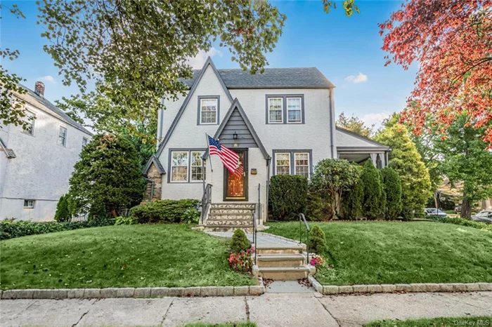 True pride of ownership on display here in this picture perfect 3 Bedroom /1.5 Bath Tudor home nestled away in the heart of Fleetwood. This home sits on a lovely corner property on a beautiful tree-lined street featuring a wide driveway with a 2 Car Garage. This charming and quaint home boasts a wonderful size Living room, a formal dining room with access to the private side porch and an Eat-in-Kitchen with a breakfast nook. There are beautifully finished hardwood floors throughout along with ample closet space. The 2nd floor consists of a spacious Primary Bedroom along with two generous size Bedrooms and a newly renovated luxurious bathroom. Welcome to your versatile walk-up attic space with its stunning cathedral ceilings, this area features an airy, open feel that&rsquo;s perfect for multiple uses like a Home Gym, play area or a cozy office that inspires creativity and productivity. The exterior of this home is well maintained with manicured lawns /bushes. The backyard is defined with a lovely patio area which is great for entertaining and enjoy the lovely garden area. Truly a commuters dream- just minutes to the Fleetwood Train station, buses, shopping centers, major parkways and 28 minutes to Manhattan. 25 minutes to Manhattan. This home is the perfect blend of comfort, convenience and affordability.