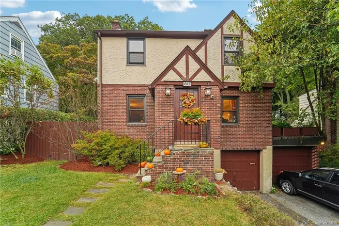 Welcome to this charming updated Tudor style home in the Alexander Smith Carpet Mills Historic District at 465 Park Ave in Yonkers. This sweet home has so many nice surprises beginning with the well laid out designer kitchen with bifold patio doors which extend out to the perfectly curated and versatile backyard, perfect for entertaining. Boasting a lovely open layout with a wood burning fire place on the first floor, generously sized bedrooms on the second floor, wonderful oak wood floors throughout, and the added bonus space in the basement is just the icing on the cake for this property. A 2 car garage and a driveway that fits up to 3 additional cars is yet another one of the many standout features of this gorgeous home. Located minutes from Saint John&rsquo;s Hospital, Hudson River Museum, the historic Untermyer Park, Glenwood Metro North Station, Ridge Hill, Executive Blvd, Saw Mill River Parkway, and more. So convenient to everything, don&rsquo;t miss this gem!