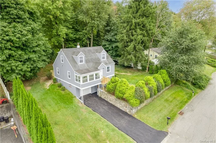 Enjoy the charm and comfort of this Cape Cod style home in the Town of Cortlandt Manor! As you enter, you&rsquo;re greeted by a welcoming foyer with a convenient coat closet and an inviting enclosed sunroom, perfect for relaxing with your morning coffee. The bright living room flows seamlessly into the dining area, complemented by an eat-in kitchen equipped with stainless steel appliances. Enjoy easy access to the back deck, ideal for outdoor entertaining or quiet evenings. On the main level, you&rsquo;ll find two cozy bedrooms and a full bathroom. Ascend to the second level, where you will find two additional bedrooms and a full bathroom, providing ample space for family or guests. The lower level features a laundry/utility room complete with washer/dryer hookups and a sink. The one-car garage adds extra convenience. This home showcases beautiful hardwood floors throughout, along with recessed and sensor lighting for added ambiance. Recent upgrades include a new 200 amp electrical service, a brand-new boiler (2024), and a newly paved driveway. Perfectly located near major schools, parks, and shopping centers like Cortlandt Town Center, as well as easy access to the Bear Mountain State Parkway, this home is ideal for comfortable living and a convenient commute.