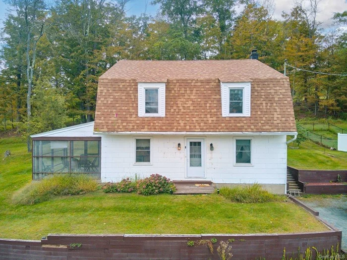 This charming four bedroom colonial on an oversized village lot is warm and cozy with touches of years gone by. The floors are original oak. The kitchen is a mixture of old and new. The windows have been replaced. the boiler is new and so is the roof. There is original wood molding in the downstairs study and along the entry. The staircase has all the original oak hand rails. All of the rooms are large and so are the closets. There is a walk up attic that provides a tremendous amount of storage space and a dry basement. The house sits on a double size lot and the views from the sunroom are magnificent. You can walk to all the little shops, and restaurants that have popped up in the village. Middletown is 20 minutes away and access to major roads and highways is a breeze. Carnation Avenue is a quiet dead end street with lovely well kept homes.