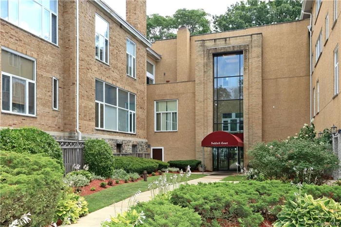 Discover loft-style living in this bright, dog-friendly duplex with serene wooded views, located in a beautifully converted school building in Ardsley! Featuring high ceilings, large windows, and an open-concept layout, the kitchen, dining, and living areas flow seamlessly together. The original one-bedroom has been thoughtfully redesigned to create two separate sleeping areas or a home office. Enjoy private in-unit laundry, two assigned parking spaces and the convenience of being close to all including shopping, transportation, restaurants, and parks. This unique unit offers modern living with historic charm in a pet-friendly community!