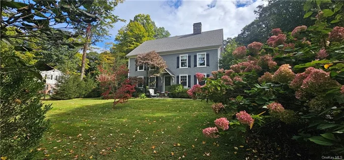 Traditional charm meets 21st century amenities in this gorgeous colonial. Situated on a beautifully landscaped 1.7 acre parcel, this three bedroom, three bath home lives so much larger, with multiple spaces suitable for working, working out or just relaxing. The living room is grounded by a large fieldstone fireplace and the family room is warmed by a Wittus woodstove on those chilly winter evenings. The kitchen boasts custom cabinetry, Viking six-burner stove and refrigerator, and Bosch dishwasher. From the kitchen, french doors lead to the pergola-shaded patio and outdoor kitchen with its fieldstone fireplace and wood-fired pizza oven, all overlooking the lush fenced yard and outdoor firepit. Upstairs features a spacious primary bedroom with its fabulous ensuite bath, two additional bedrooms and a beautiful hall bath. The home has a geothermal heating and cooling system, installed in 2020, which keeps utility costs low. In addition, the home has a whole-house backup generator.