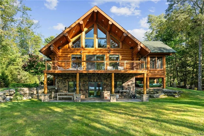 Experience the pinnacle of lakefront living in this 3, 880 sq. ft. custom-built log home, perfectly situated on the serene shores of a glacier fed, non-motorboat lake. With 3 bedrooms 2.5 baths and stunning views throughout, this home offers a seamless blend of luxury and nature. Step out onto the expansive deck to witness breathtaking sunsets, while a family of majestic eagles glides over the tranquil water offering a daily display of nature&rsquo;s beauty. The lake&rsquo;s pristine, sand bottom shores are perfect for swimming, paddleboarding and kayaking while the 80-foot depth in the center offers incredible fishing and sail boating. Inside, the home features an open floor plan with cathedral ceilings exposed beams, and hardwood floors. Large windows flood the space with natural light and frame the spectacular water views. Custom blinds throughout. The first floor primary suite provides ultimate comfort and convenience, while the large stone fireplace in the living room invites you to gather for cozy evenings. The gourmet kitchen is ideal for entertaining, boasting granite countertops, stainless steel appliances, and a farmhouse sink. A custom bar and built-in sound system elevate the experience. On the second floor, 2 additional bedrooms, a full bath, and a loft that offer beautiful views of the lake, while the lower level features a finished family room perfect for entertaining. Outside, the landscaped property is designed for outdoor living, with a flagstone patio and a screened-in porch for enjoying warm summer nights by the lake. The detached 2 car garage includes a spacious loft, perfect for a yoga studio or creative space. A dedicated office with high-speed internet makes this home ideal for remote work, blending convenience with a peaceful atmosphere. Modern comforts include central air, a whole house generator,  a new furnace and AC condenser, as well as new gutters. There&rsquo;s also boat storage making lake life even more enjoyable. Located near the Delaware River, Barryville&rsquo;s farmers market, antique shops, fantastic restaurants and skiing close by. This home offers a unique balance of adventure and tranquility. You&rsquo;ll also be close to the world-renowned Kadampa Meditation Center, a peaceful sanctuary for spiritual retreats, and Bethel Woods Performing Arts Center. For year-round fun, New York&rsquo;s largest indoor water park is also nearby. With 2 hour access to New York City and 15 minutes from the Metro-North train, this peaceful escape offers the best of both worlds. This contemporary, 3-story log home is more than just a luxurious retreat, it&rsquo;s your personal haven where you can enjoy daily wildlife sightings, tranquil sunsets, and the ultimate lifestyle that effortlessly combines modern living with nature&rsquo;s wonders.