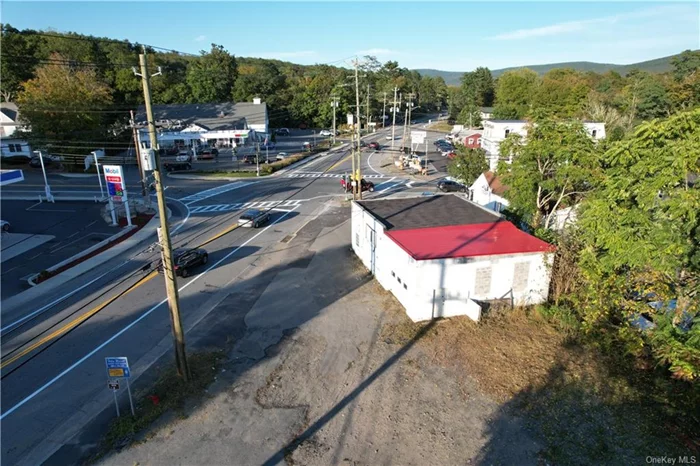 With extreme high visibility and high traffic at this busy intersection with signal light - this location can&rsquo;t be beat! Across from two gas stations, convenience store, Dunkin Donuts and a long-standing restaurant/ pub this prime corner spot is waiting for a new opportunity. Property is situated on State Route 209 and Sullivan Street in Wurtsboro just a mile +/- from NYS Route 17/ I-86. Building was damaged in an accident so it needs work or demolish and start from scratch. Previous use was a car service business. Nearly 6000 average daily traffic count on Rt 209 and over 4000 on Sullivan Avenue. Perfect location with plenty of parking for many uses: retail, medical, pharmacy, take-out, salon, professional offices and more! Perfect Opportunity for start up or move your business to the Sullivan County Catskills country. Wurtsboro is a quaint yet bustling town with history in southern Sullivan County only a few minutes to the Orange County line, and an hour to NYC.