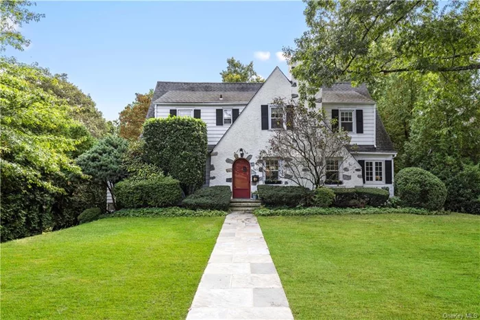 Located on a quiet street in sought-after Scarsdale neighborhood, 56 Woods Lane offers the perfect blend of character & convenience. Walk to NYC train, village shops, restaurants, parks, Edgewood Elementary & Scarsdale HS. Free bus to Scarsdale MS. The home features 4 bedrms, plus an office, 2 full bathrms & a powder rm. A nicely renovated kitchen opens to the rear deck overlooking a flat, bucolic backyard serene & private, perfect for outdoor dining & play. The interior showcases lovely hardwood floors, character moldings & arched front door. Off the kitchen is a private home office (potential 5th bedrm). On Level 2, there is a spacious primary bedrm w/ensuite bath & 5 closets, plus 3 add&rsquo;l bedrms & hall bath. High ceilings & a large, walk-out basement offer great potential for recreation, movie theater &/or home gym. Amenities incl gas heat, central air, EV charger, versatile floor plan, sunny interior & fab location! Enjoy the best of all - updated home w/character & functionality!