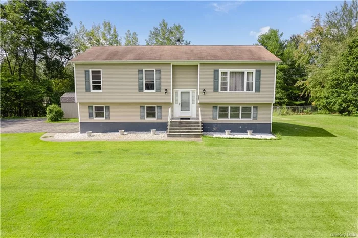 Welcome to 237 Lake View Rd! A charming Raised Ranch in the heart of Hillside Lake, East Fishkill, awaiting its new owner. With tasteful updates throughout, this home features almost 2000 finished SQ FT, 3 bedrooms, 2.5 baths, central air and situated on a large 1 acre lot. Fully finished lower level with laundry, powder room, play room/gym/flex space, and walk-out to the spacious backyard, perfect for entertaining! Attached oversized 2 car garage, full attic for added storage space and oversized shed. Low taxes and priced to sell! Excellent location, minutes to Taconic PKWY, I-84, all things shopping, schools and more! TO SEE IS TO BELIEVE!