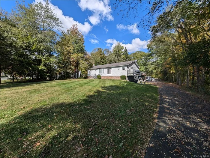 One level living at its best, this bright and airy Ranch home is nestled on a level lot with over 3 acres of land!  The home features 3 nice size bedrooms and 2 full bathrooms. The kitchen has beautiful white cabinets and includes all existing appliances. You have a deck off the kitchen which is great for BBQ&rsquo;s. The living room has high ceilings and has a wide-open feel.  The primary bedroom offers a large closet and an ensuite bathroom with soaking tub and shower.  The additional two bedrooms and full guest bathroom are located on the other side of the living room offering privacy. Oversized walkout basement with laundry room has the potential for so many possibilities! Features include privacy, a large lot, blacktop area great for multiple vehicles, RV, etc and so much more! A commuter&rsquo;s dream, less than 60 miles to NYC, close to 84, 87, 17, Metro North, NJ Transit, bus, Stewart & West Point. Call now this one will not last.