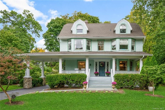 The best of both worlds. Fall in love the moment you step onto the grounds of this meticulously preserved 1910 Colonial with Dutch Revival architectural details. Situated on nearly half an acre of beautifully manicured lawns and gardens, this home invites you to experience outdoor living at its finest. Picture yourself lounging on the expansive patio or enjoying evenings around the charming pebbled fire pit, surrounded by the lush serenity of mature plantings. The grand front porch leads you through a fully restored, century-old front door and opens to the main level with high ceilings, spacious areas like the cozy parlor, beautiful dining and living rooms bathed in natural light, where timeless details like hardwood floors, restored door moldings and wood-burning fireplaces stand as testaments to the home&rsquo;s craftsmanship. These sophisticated updates create an inviting atmosphere. Eat-in-kitchen, with marble countertops, stainless steel appliances and custom cabinetry; flowing effortlessly to an expansive outdoor patio a perfect setting for al fresco dining, entertaining or relaxing in serene surroundings. The second level is a sanctuary of comfort, a luxurious primary suite with an oversized glass-enclosed shower, complemented by three additional spacious bedrooms and a full hall bath. The third level offers incredible flexibility with two more bedrooms and a versatile home office, ideal for today&rsquo;s lifestyle needs. Ample closet space throughout.  The lower level offers an additional approx 792 SF, not included in the listed SF, laundry room, workshop area, space for home gym and provides easy walk-out access to the backyard. Outside, a newly paved driveway and breezeway carport add convenience and functionality. This home offers you the grace of the past and the comforts of today. Designed for those who appreciate timeless beauty and modern conveniences within a historically rich neighborhood in Rochelle Heights. Residents enjoy exclusive access to the neighborhood&rsquo;s private tennis courts. Located just 30 minutes from Manhattan on Metro North.