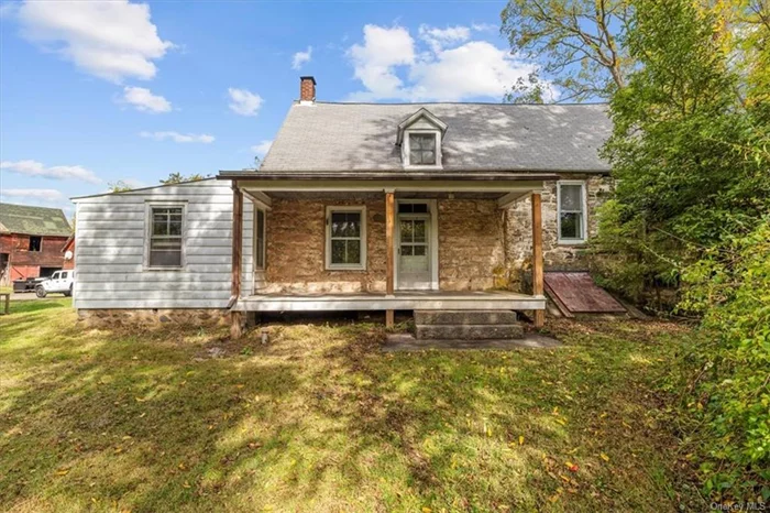 Circa 1700 stone house ready for restoration! Located in the charming hamlet of Stone Ridge and just 7 miles to Kingston, this 6.48 acre compound includes a large barn, several small outbuildings and a large open meadow.  The cozy historic stone house has lovely original wide board floors and beams, with three bedrooms on the second floor and a nicely sized living room, dining room and kitchen on the main floor.  The full unfinished basement houses all mechanicals. The house and outbuildings are located on the 5 acre parcel and there is a separate 1.48 acre parcel included in the sale. Recent improvements include well pressure tank and hot water heater. Propane furnace is approximately 10 years old, roof 20 years old. This property conveys in as-is condition and would make a wonderful small farm compound with restoration.  Centrally located in the heart of the Hudson Valley - less than 15 minutes to Kingston, 20 minutes to Woodstock and New Paltz.  Enjoy all that the area has to offer  Catskill and Shawangunk hiking, Rondout Valley farmstands, breweries and more.