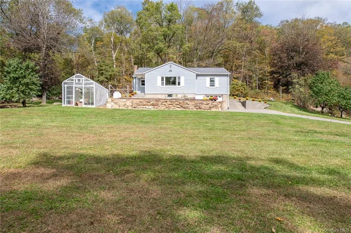 Unique opportunity to own this charming property with a rich history as a successful Community Supported Agriculture (CSA) farm! This peaceful, country home has 3 nicely sized bedrooms, 1.5 tastefully updated baths (main bath has radiant heated flooring) and lovely hardwood flooring throughout. From the moment you step inside, you&rsquo;ll notice the amazing natural sunlight this home is enveloped in. The living room is so inviting and flows seamlessly into the beautifully updated, eat-in kitchen with bay window, recessed lighting, Corian countertops and stainless steel appliances making this the perfect home for entertaining. The lower level has incredible finishing potential and could be future family room plus office/gym, etc. It also includes a wood stove which could help offset heating bills in the colder months. Brand new roof (2023). This home is perfect for those seeking a more sustainable lifestyle. The expansive lot (2.47 acres) is primed for gardening, featuring a 10&rsquo;x20&rsquo; movable, heated greenhouse along with multiple gardening beds, prep stations and stainless steel double sink in the 1 car garage. There are at least 12 peach trees, multiple raspberry bushes, Jerusalem artichokes, asparagus and more. Whether you&rsquo;re a gardening enthusiast, an aspiring farmer or simply want room to grow, this property offers endless possibilities. Enjoy the best of rural living while still being close to Metro North, shopping, the Harlem Valley Rail Trail, the Appalachian Trail and the Connecticut border. Don&rsquo;t miss this special home!