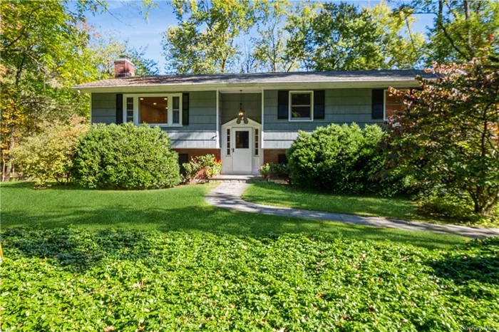 This recently updated rental home features an easy layout and is located less than a mile from downtown Chappaqua and the Metro North station, making it ideal for commuting and accessing local amenities. It is available furnished or unfurnished and has been freshly painted, making it move-in ready. The bright and open layout includes spacious indoor and outdoor living areas. The main level features an open living and dining room, a kitchen, a primary suite, two additional bedrooms, and a beautifully updated spa-like hall bath. Enjoy peaceful views from the screened porch and deck overlooking a protected Audubon Sanctuary. The lower level includes a cozy den with a fireplace, a laundry room, ample storage, and a two-car garage. The property is conveniently located near award-winning schools, farmers markets, an art center, and shopping at Chappaqua Crossing. Rent includes landscaping and snow removal.