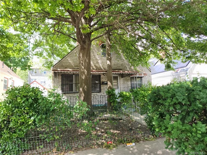 Detached 1 Family Home! 2 bedrooms, living room, kitchen, dining area and 1 bath. Center stairs leading up to full stand up attic. Full basement. Driveway and 38x95 lot. Needs complete renovation and is an ESTATE SALE. SOLD AS IS!