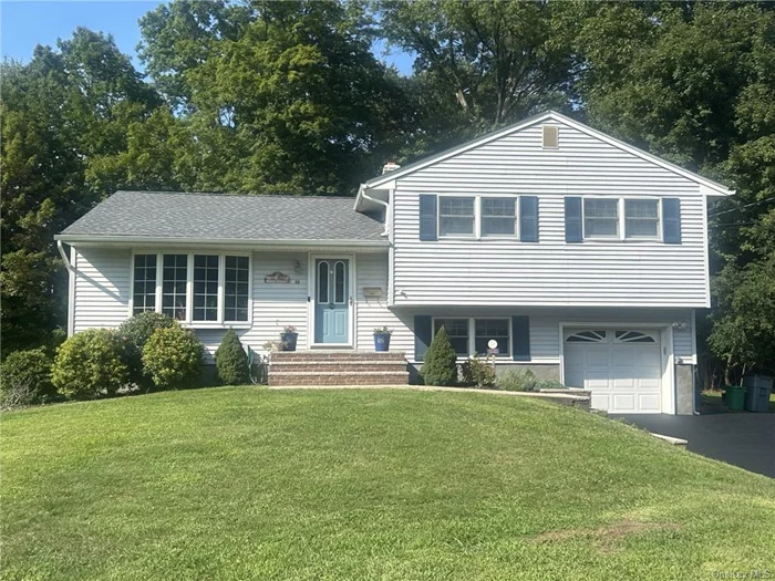 New City NY 1850sqft split level house on 1/3 acre on a quiet street with parklike property. Recently painted interior with 3 bedrooms , 2 1/2 baths and a bright additional room off kitchen. Clarkstown Schools. Offered at 699, 000